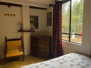 Postel nebo postele na pokoji v ubytování Arte sin Fronteras Hostel