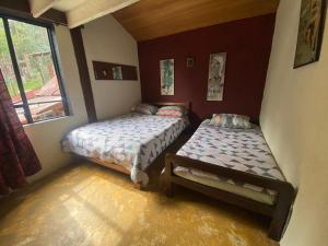 Postel nebo postele na pokoji v ubytování Arte sin Fronteras Hostel + 18 fotografií