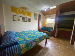 Postel nebo postele na pokoji v ubytování Arte sin Fronteras Hostel