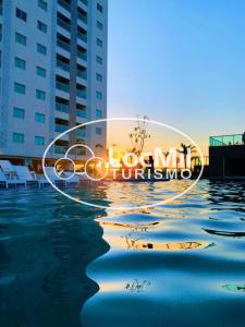 a picture of a hotel with the words dog mitzvah offshore at Apartamento em Resort - Park in Salinópolis