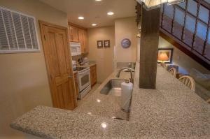 a kitchen with a sink and a counter top at Bear Lake Hideaway condo in South Lake Tahoe