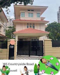 a picture of a house with two children in front of it at 花园别墅 in Singapore