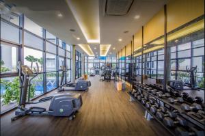 a gym with treadmills and elliptical machines at Duplex Town House at EcoBotanic Near Legoland with Netflix and KTV System in Nusajaya