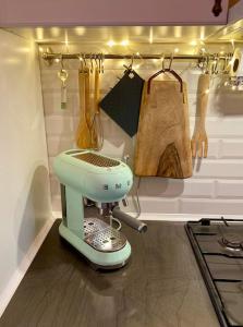 a kitchen with a blue mixer in a room at No.8: Lovely & Cosy 3-room Heart of the City in Timişoara