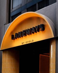 a sign for a hawkeyes store on a building at Laneways by Ovolo in Melbourne