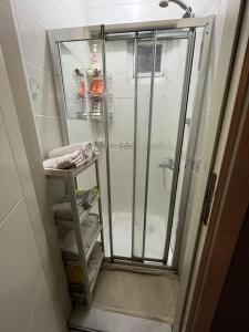 a walk in shower with a glass door in a bathroom at Live in Fatih, live Istanbul in Istanbul