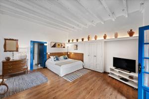 Ένα ή περισσότερα κρεβάτια σε δωμάτιο στο La Hacienda Grande