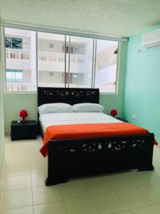 מיטה או מיטות בחדר ב-Apartamento 603 Cartagena Bocagrande a 1 cuadra de la playa