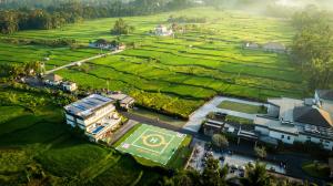 an aerial view of a building with a baseball field at Viceroy Bali in Ubud
