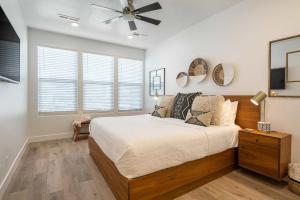 a bedroom with a bed and a ceiling fan at Desert Azul townhouse in St. George