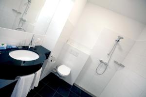 Een badkamer bij Hotel De Bonte Wever Assen