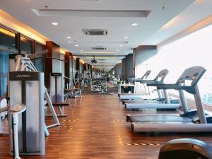 a gym with a row of treadms and machines at NEW! Atlantis Residence I D1607 Premium 2BR I 5-10pax I Swing I JonkerSt I City Centre by Jay Stay in Melaka