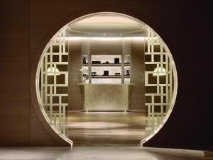 a room with a large circular window with a counter at Langham Place Guangzhou - Walking distance to Canton Fair in Guangzhou