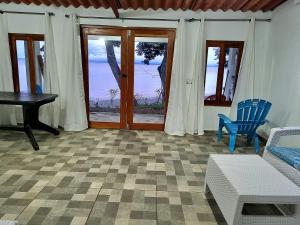 a living room with a view of the ocean at Isla Cébaco in Isla Cebaco 