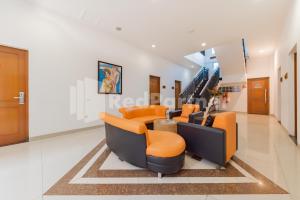Istumisnurk majutusasutuses Hotel Alqueby near Kiara Artha Park Mitra RedDoorz