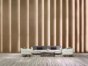 a living room with a couch and two chairs at Langham Place Guangzhou - Walking distance to Canton Fair in Guangzhou