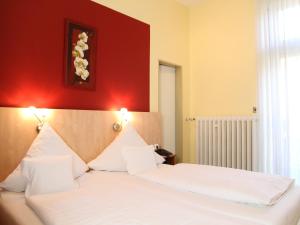 Postel nebo postele na pokoji v ubytování TOP Hotel Amberger