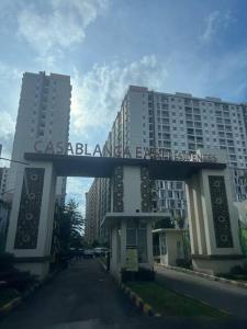 a building with a sign that reads casablanca earth agency at Apt Casablanca East 2BR With Netflix and Pool in Jakarta