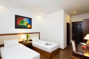 Postel nebo postele na pokoji v ubytování Starlet Hotel