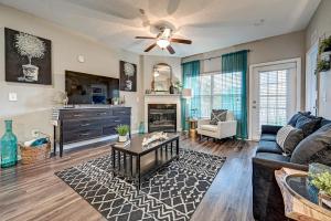 a living room with a couch and a table at Westside Retreat with Private Balcony Nr DWTN Jax in Jacksonville