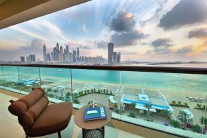 a living room with a view of the city at Marriott Resort Palm Jumeirah, Dubai in Dubai