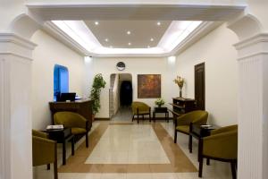 a lobby with chairs and a waiting room at Barakat Hotel Apartments in Amman