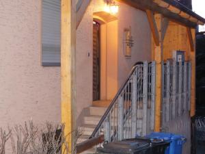 a porch of a house with a metal staircase at Ferienwohnung in Nürnberg in Nuremberg