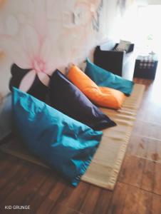 a group of pillows sitting on a couch at Tara hostel in Nusa Penida