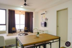 a living room with a couch and a table at COZY Bali Residence Apartment NEARBY KLEBANG BEACH in Tranquerah