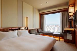 Postel nebo postele na pokoji v ubytování Candeo Hotels Nankai Wakayama