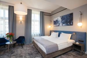 Posteľ alebo postele v izbe v ubytovaní Hotel Unicus Krakow Old Town - Destigo Hotels