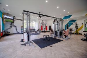 a gym with several tread machines in a room at 1 BR 1BA Oasis Near LSU and Casino Free Parking in Baton Rouge