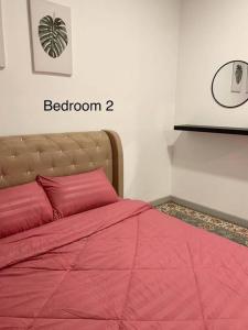Voodi või voodid majutusasutuse COASTAL INN toas