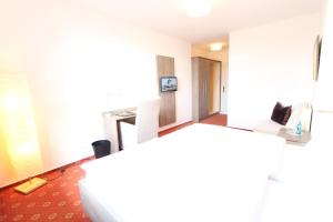 TV a/nebo společenská místnost v ubytování Hotel Thormählen