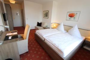 Postel nebo postele na pokoji v ubytování Hotel Thormählen
