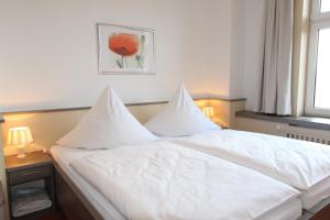 Postel nebo postele na pokoji v ubytování Hotel Thormählen