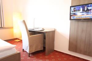 TV a/nebo společenská místnost v ubytování Hotel Thormählen