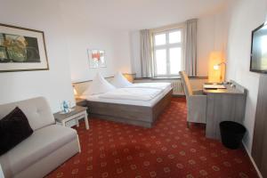 Postel nebo postele na pokoji v ubytování Hotel Thormählen