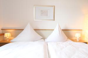 Postel nebo postele na pokoji v ubytování Hotel Thormählen