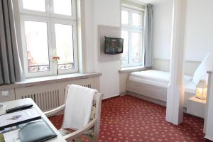Postel nebo postele na pokoji v ubytování Hotel Thormählen