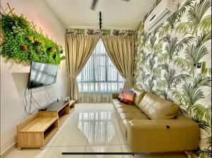 a living room with a couch and a tv at COZY D'Summit 2 Bedrooms @ 100mbps HIGH SPEED WIFI in Skudai