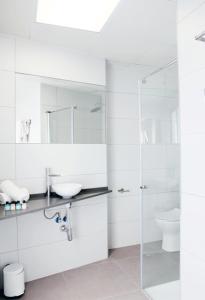 a white bathroom with a sink and a toilet at San Remo in Alicante