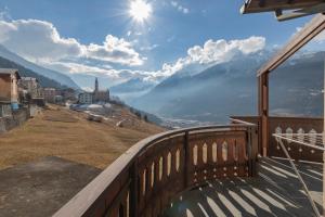 a balcony with a view of the mountains at New apartment in Bormio - Centrale 20 in Piatta