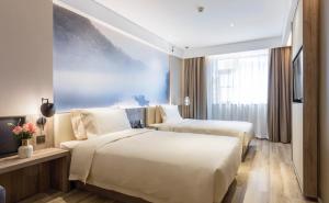 Postel nebo postele na pokoji v ubytování Atour Hotel Changsha IFC Center