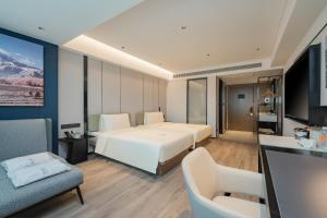 Katil atau katil-katil dalam bilik di Atour Hotel Qingdao Central Business District University of Science and Technology