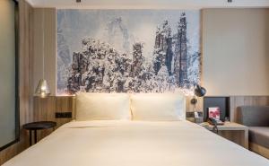 Postel nebo postele na pokoji v ubytování Atour Hotel Changsha IFC Center