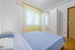 Ein Bett oder Betten in einem Zimmer der Unterkunft Garden apartment