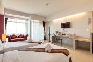 Postel nebo postele na pokoji v ubytování Tubtim Siam Suvarnabhumi Hotel