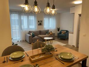a living room with a table and a couch at Ravna Planina in Pale