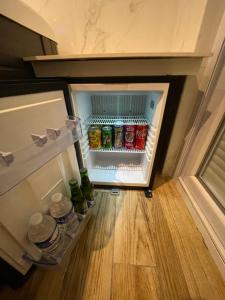 an open refrigerator filled with lots of drinks at Luxury spa vallon in Vallon-Pont-dʼArc